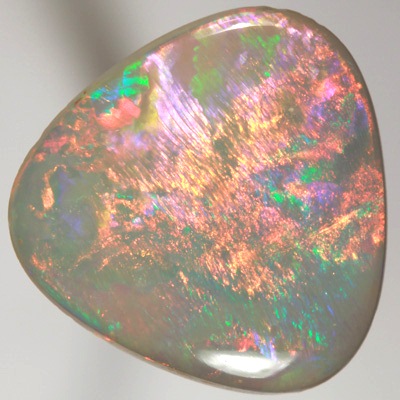SOLID SEMI BLACK OPAL Large rolling flashes of neon red over green SEE VIDEO  